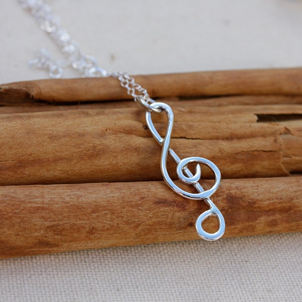 Treble Clef sterling silver Pendant on chain.  Musical note signs. Music necklace. Silver Wire handformed roll milled design.