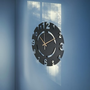Modern Black Metal Wall Clock: Minimalist Cutout Number Design
