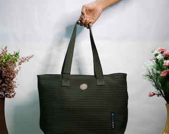 The Como The Tote-All Bag! Green is the new black! Eco-friendly! Created from certified OBP fabric* Buy one give to a child in crisis