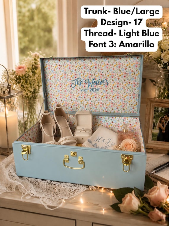 A fabric-wrapped, custom-embroidered metal trunk that doubles as a heirloom-grade memory chest — 268 favorites don't lie, this thing looks stunning.