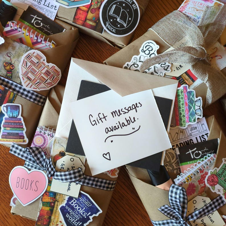 May include: A collection of wrapped gifts with a variety of decorative paper, ribbons, and embellishments. The gifts are decorated with book-themed stickers and the text "Gift messages available." is written on a white card.