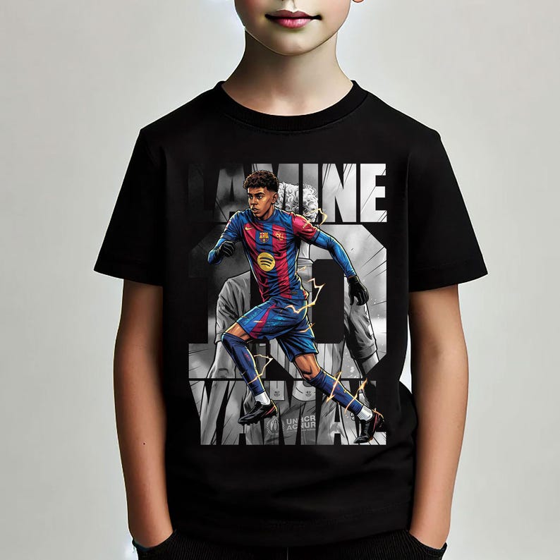 May include: Black t-shirt featuring a graphic of a soccer player in a red and blue uniform, with the name "LAMINE" in white block letters. The shirt also has the Spotify logo and the text "UNHCR".