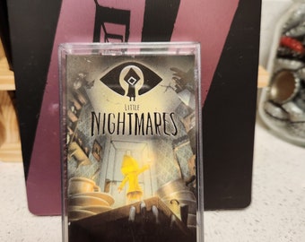 May include: A clear plastic case with a black and white image of a video game character. The image is of a young girl in a yellow raincoat standing in a room with a large eye and the words "Little Nightmares" printed on the case.