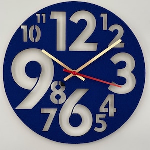 Modern blue wall clock with cut-out numbers – stylish, quiet & functional, laser-cut from wood and felt