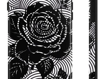 May include: Black and white phone case featuring a large rose design. The rose is intricately detailed with a spiral pattern, set against a background of concentric circles. The case is black with a glossy finish.