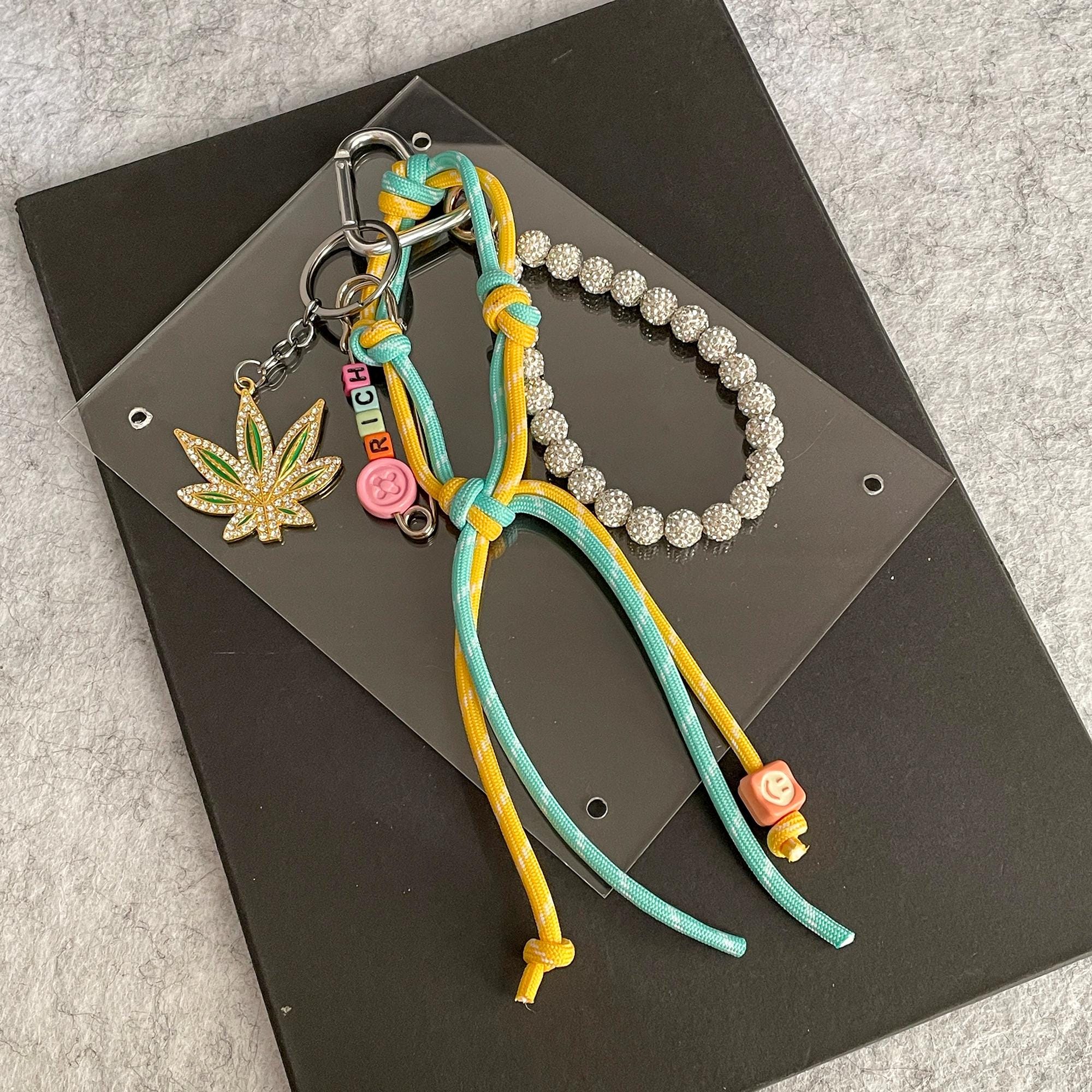 Miu Miu Black Leather Double-Wrap Bracelet with Gold Flower Charm Miu Miu // Gold & Orange Leather Heart Charm Bracelet – VSP  main image 3