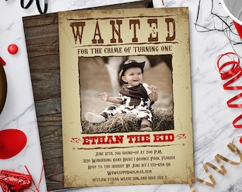 May include: A vintage-style wanted poster with a photo of a baby dressed as a cowboy. The poster says "WANTED for the crime of turning one" and "ETHAN THE KID". The poster includes details for a birthday party, including the date, time, location, and RSVP information.