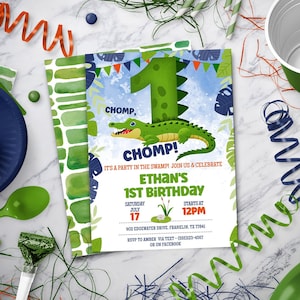May include: A green and blue alligator birthday party invitation with the text "CHOMP, CHOMP!" and "Ethan's 1st Birthday". The invitation has a green number one with a cartoon alligator on it. The invitation also includes the date, time, and location of the party.
