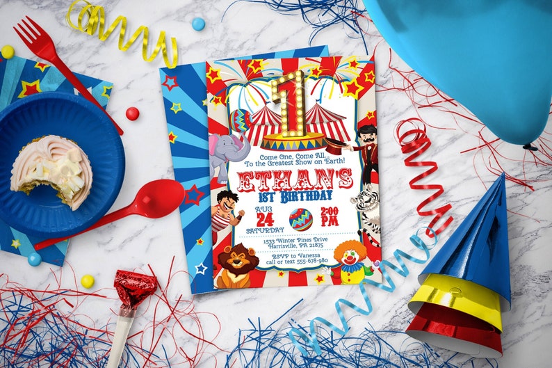 May include: A red, white, and blue circus-themed birthday invitation for Ethan's 1st birthday. The invitation features a big top tent, a clown, a lion, and a tiger. The text on the invitation reads "Come One, Come All To the Greatest Show on Earth! Ethan's 1st Birthday Aug 24 2:00 PM 1533 Winter Pines Drive Harrisville, PA 25VP to Vanessa call or text 555-676-900".