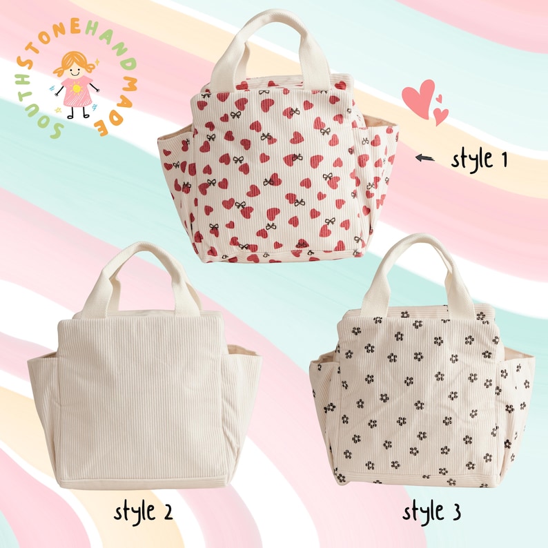 May include: Three small tote bags with handles. One bag has a cream background with red hearts and bows. Another is solid cream corduroy. The third has a cream background with black floral patterns. The bags have side pockets.