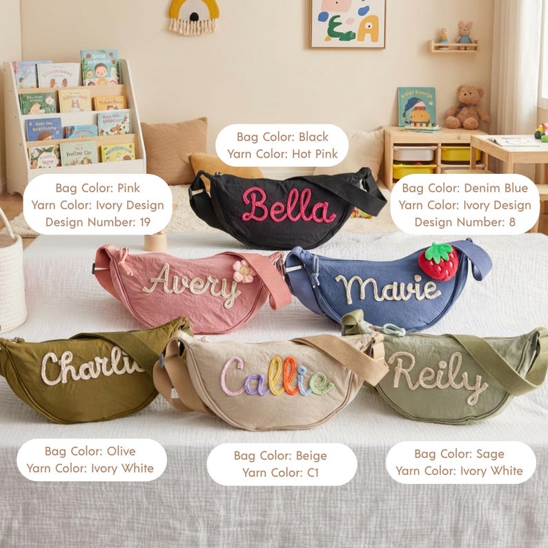 May include: Six crescent-shaped crossbody bags in various colors including black, pink, denim blue, olive, beige, and sage. Each bag features a personalized name embroidered in yarn on the front, with some bags accented by small floral or fruit charms.