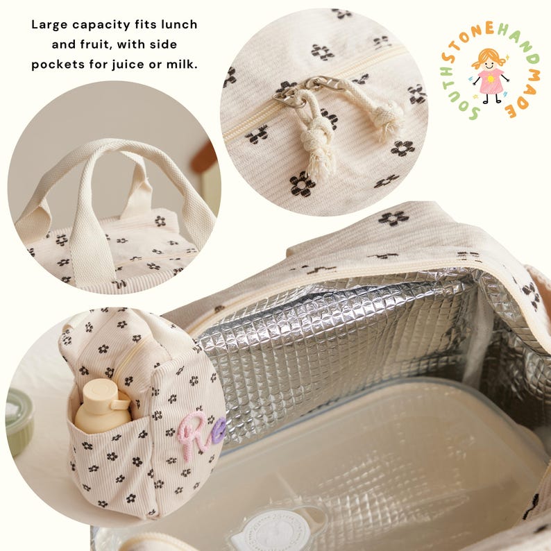 May include: Beige lunch bag with black floral pattern, featuring a zipper closure and sturdy handles. The bag has side pockets and a large capacity for lunch and fruit. The bag includes a small matching pouch with a bottle.