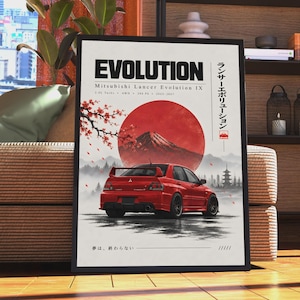 May include: A framed poster featuring a red Mitsubishi Lancer Evolution IX car centred below a large red sun and a mountain. The text reads EVOLUTION, Mitsubishi Lancer Evolution IX, 2.0L Turbo, AWD, 280 PS, 2005-2007, Japanese characters, and 夢は、終わらない.