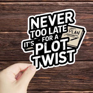 May include: White sticker with black text that reads "Never too late for a plot twist." A small drawing of a notebook with the word "Plan" written on it is included in the design.