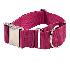 May include: A pink nylon dog collar with a silver buckle and a silver D-ring.