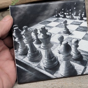 May include: A black and white drawing of a chessboard with chess pieces on it. The chess pieces are in the foreground and the chessboard is in the background. The chess pieces are all in black and white and are made of a smooth, shiny material. The chessboard is made of a rough, textured material.