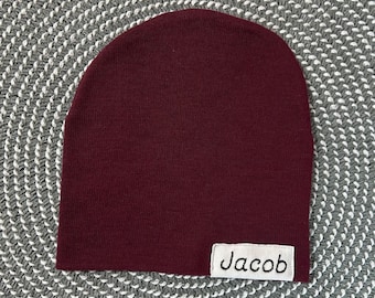 Newborn slouch beanie in burgundy sweater knit