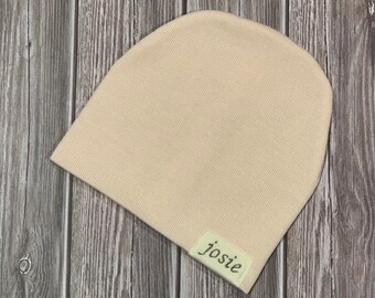 Newborn slouch beanie in blush peach sweater knit