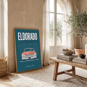 May include: A framed wall art print featuring a teal background with the white text ELDORADO at the top and CADILLAC at the bottom. A large outline of the number 1959 sits behind a centred illustration of a coral-coloured 1959 Cadillac car.