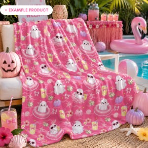 Example product mockup featuring a pink blanket with the Pink Summer Ghost Pool Party seamless pattern, displayed at a Summerween pool party with cute ghosts, heart floats, lemonade, pastel pumpkins, flowers, seashells, bows, starfish, tropical decor, and girly Halloween summer vibes.