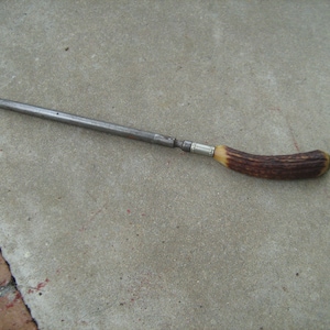 Vintage deer antler or bone handle and metal knife sharper.