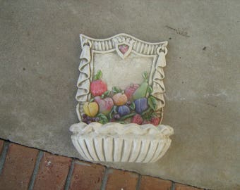 A 1960s vintage unicorn merchandise corp. chalkware hanging fruit basket.