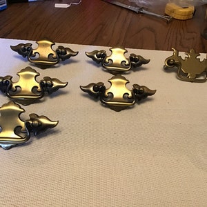 6 vintage stamped antique brass finish drawer pulls with screws and drop bail L-2.