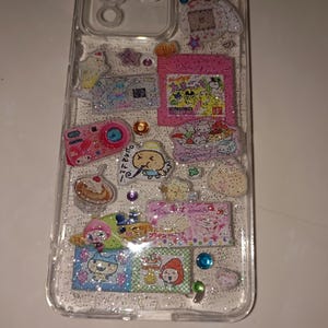 Unique glitter phone case featuring kawaii pop culture designs, hologram shine, and colorful gemstones for Y2K lovers.