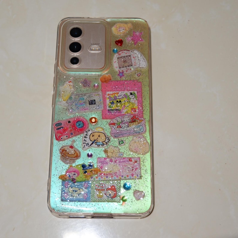 Japanese kawaii sticker resin phone case with holigram and silver glitter details. Perfect for y2k and juminocore aesthetic lovers.