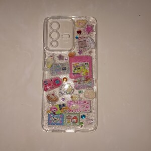 Handmade clear case decorated with colorful, holographic Japanese-inspired stickers and tiny rhinestones, Decora Kei style.
