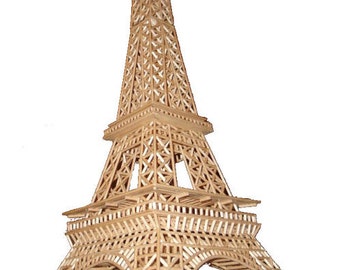 May include: A model of the Eiffel Tower constructed entirely from wooden matchsticks. The tower is a light brown colour and features intricate latticework.