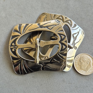 2 EARLY SWIMWEAR BUCKLES