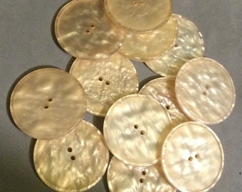 12 PLASTIC BUTTONS, LARGE