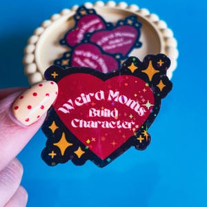 Weird Moms Build Character- Star Glitter Holo Vinyl Sticker image 1