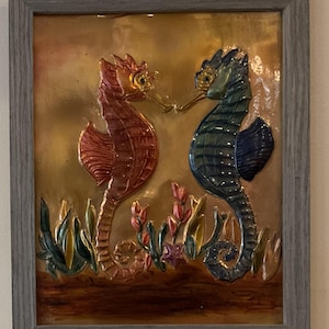 Seahorse copper embossed art. A distressed gray 8x10 pine frame with table top and wall mounting options.