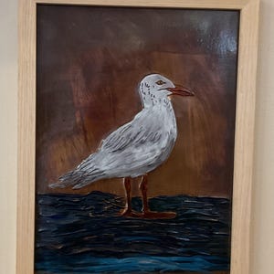Seagul copper embossed art. Natural pine frame with table top and wall mounting options. Copper embossing is 9x12.