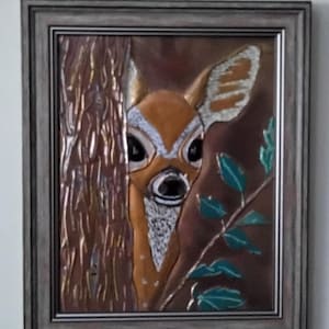 Doe copper embossed art.  Includes tabletop and wall mounting options in a silver toned 8 x 10 frame.