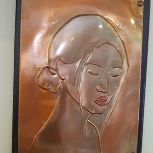 Asian woman copper embossed art. Black painted 9 x 12 canvas frame with table top and wall mounting options