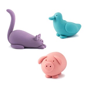 May include: Three colorful play dough animal figurines: a purple cat, a pink pig, and a blue duck.