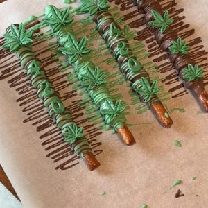 Caramel wrapped chocolate covered pretzel rods