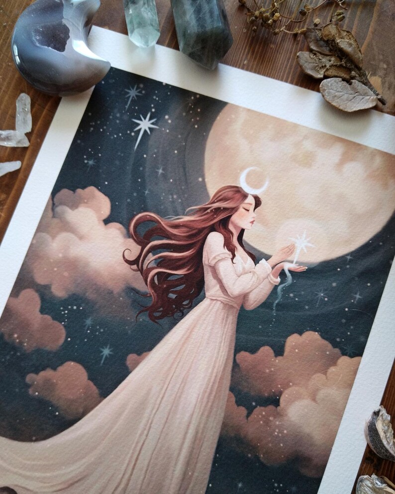 May include: A watercolor painting of a woman with long brown hair wearing a white dress standing in front of a large, full moon. She is holding a small, white star in her hand. The background is a dark blue sky with clouds and stars.