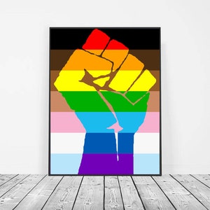 May include: A black fist raised in the air, with the colors of the Progress Pride flag. The colors are brown, yellow, red, green, light blue, dark blue, and purple.