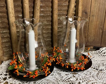 Primitive Glass Hurricane Lantern surrounded with a Fall Inspired Berry Ring with a Flameless Candle