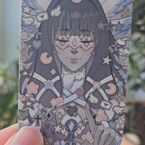 Front facing photocard of Genshin Impact's Columbina