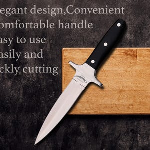 May include: A stainless steel knife with a black handle and three white rivets. The knife is on a wooden cutting board. Text on the image reads: Elegant design, Convenient, Comfortable handle, Easy to use, Easily and quickly cutting.