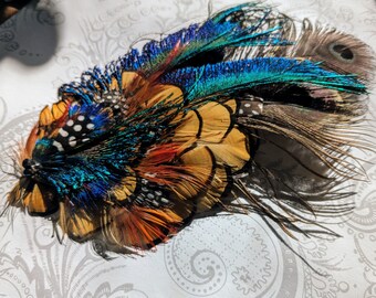 Nica Feather Hair Clip - green, gold, blue, black and white all natural feather fascinator with crystals