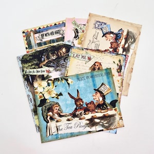 May include: A selection of Alice in Wonderland themed postcards with vintage illustrations. The cards depict characters such as the Mad Hatter and Alice. Text includes "Drink Me" and "Off With Her Head!" on some cards.