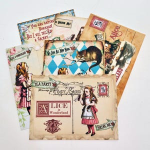 May include: A selection of vintage postcards with illustrations and quotes from "Alice in Wonderland." The postcards feature images of Alice, the Cheshire Cat, and other characters, with phrases such as "Drink Me" and "We Are All Mad Here."