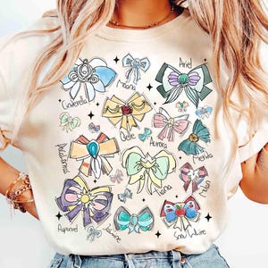 Watercolor Coquette Bows Disney Princess T-shirt, Disney Aurora Ariel Belle Cinderella Tiana Shirt, Magic Kingdom Disneyland Girl Trip Tee