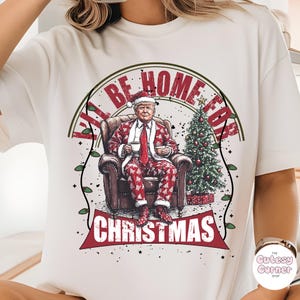 トランプのクリスマスには家に帰るよシャツ、ユーモラスなトランプのクリスマスシャツ、トランプのクリスマス共和党員のTシャツ、おもしろいトランプのサンタのスウェットシャツ